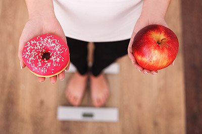 Woman holding donuts