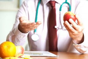 Doctor holding an apple