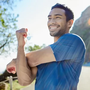 Man smiling and stretching